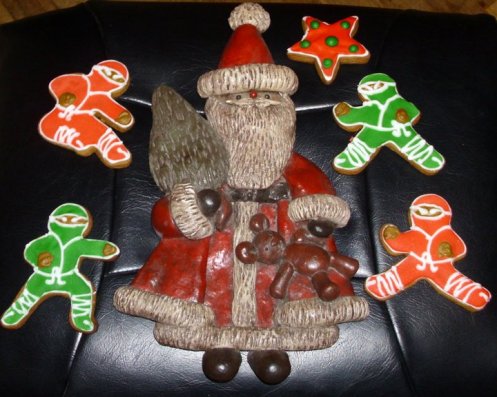 Piped and frosted Ninjabread Cookies. I also made the Santa from salt & flour dough. He is painted and sealed with polyurethane. He's about 20 years old now and still holding up!