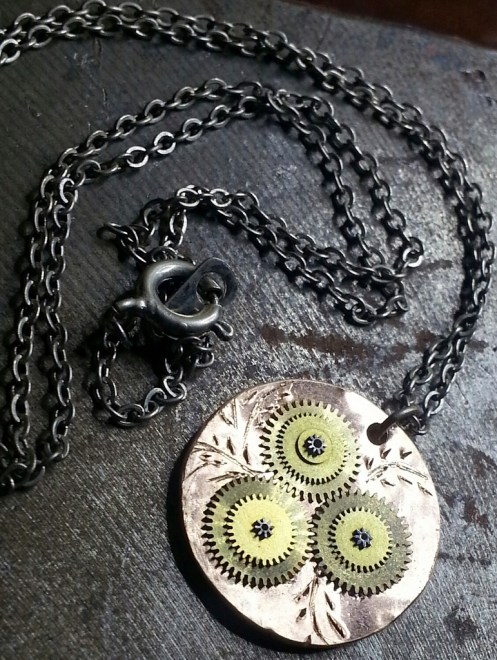 Made a pendant out of a penny, some watch gears and a little etching.